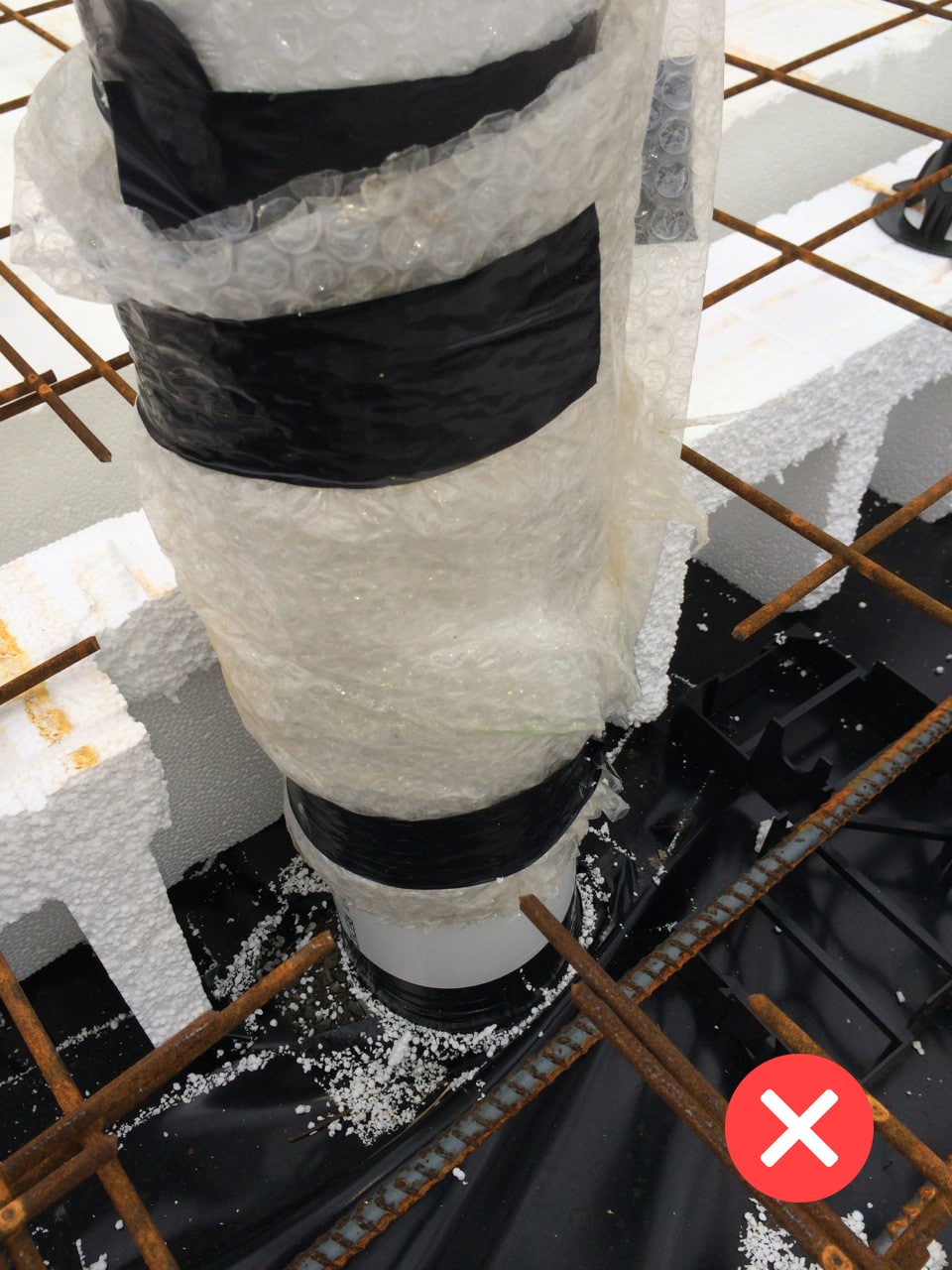 Bubble wrap falling short of the D.P - Poor installation of membranes around service ducts.