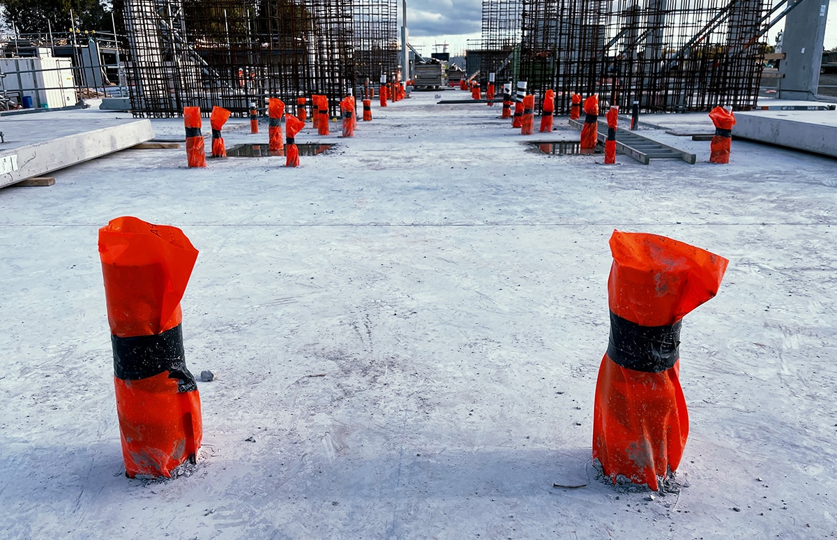 Apache plumbing sleeves at a commercial construction site 3 - Why did we pick SAFETY ORAGE as the colour of our Apache plumbing sleeves?